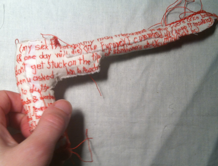(freedom is a trip). Poem by Montana Ray. Soft, embroidered/stuffed "gun" by Iviva Olenick. An extension of @EmbroideryPoems. 2014. 3.5" h x 7" w x 1" d.